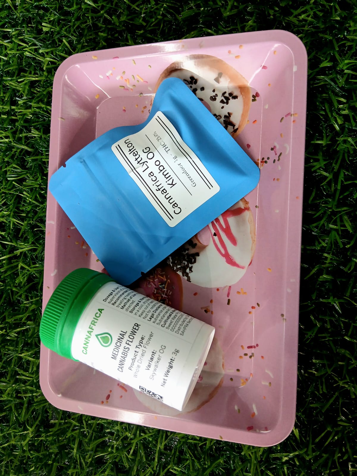 Skywalker OG jar and Kimbo OG pack on a rolling tray