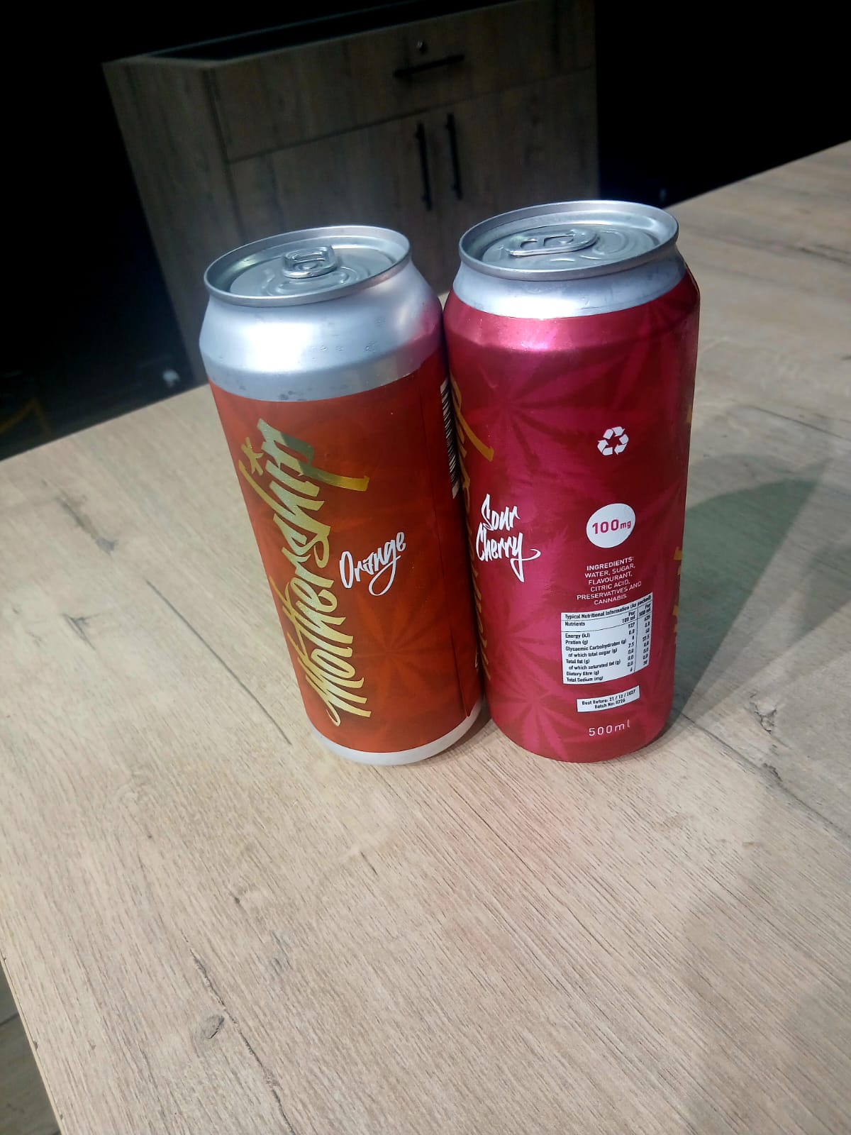 Mothership cannabis-infused drinks — orange and sour cherry 500ml cans